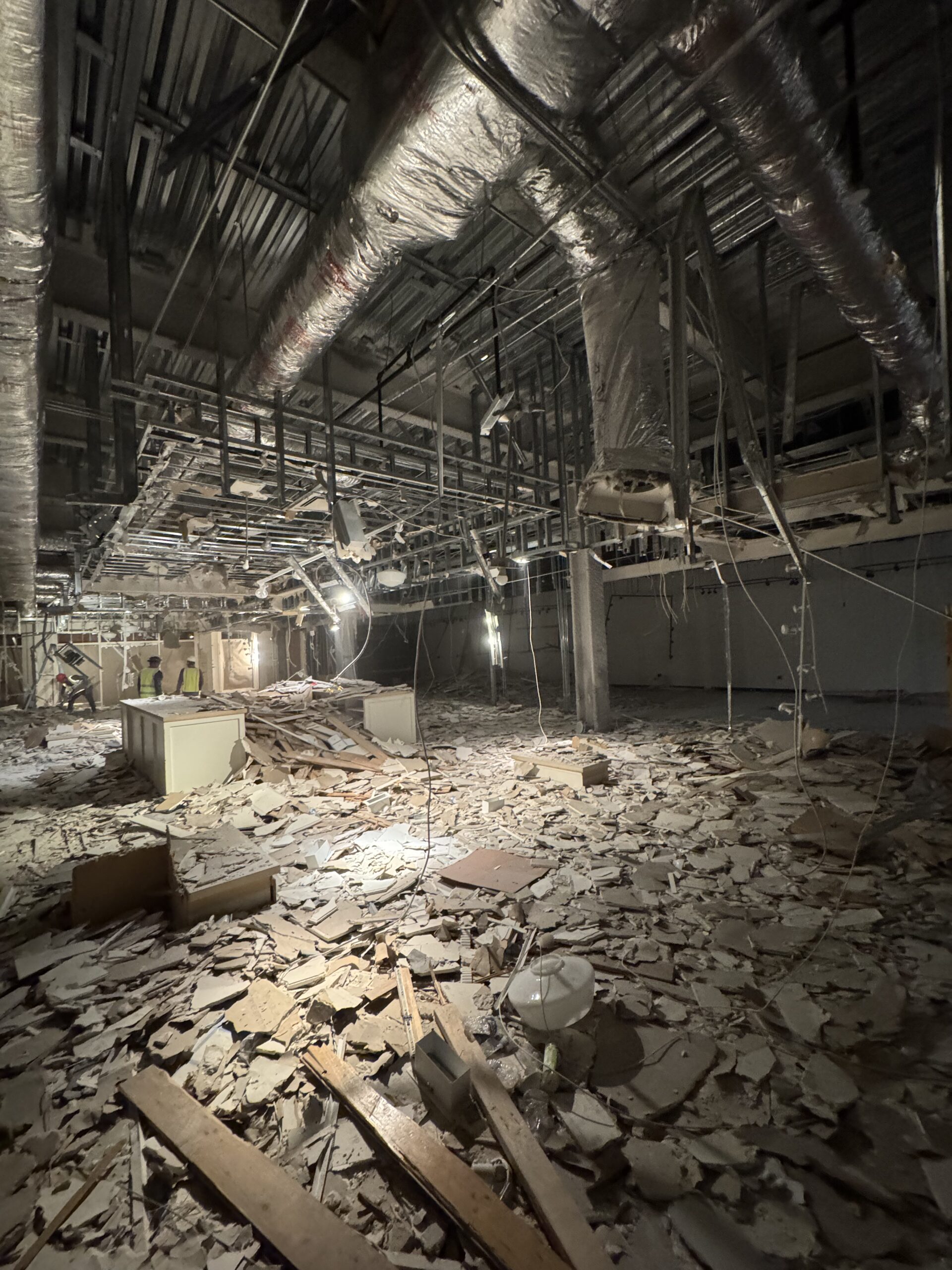 Crew gutting a building interior during abatement